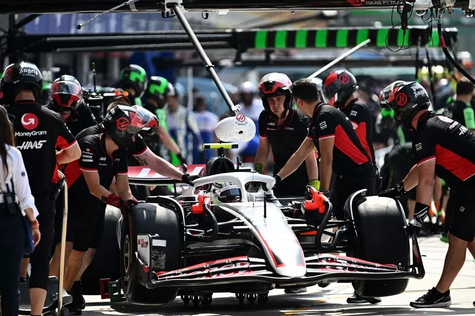 Mechanics return Nico Hulkenberg, Haas VF-24, to the garage