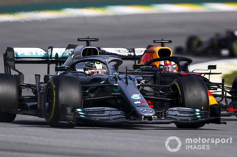 Lewis Hamilton, Mercedes AMG F1 W10 leads Max Verstappen, Red Bull Racing RB15 at the restart