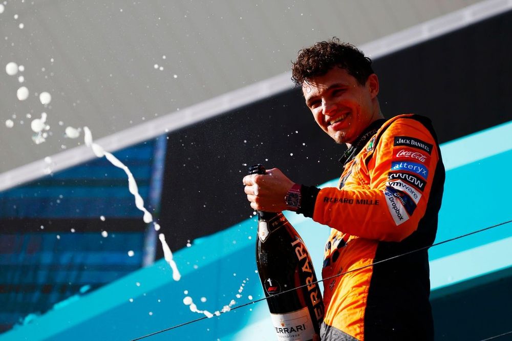 Lando Norris, McLaren F1 Team, 1st position, sprays champagne in celebration