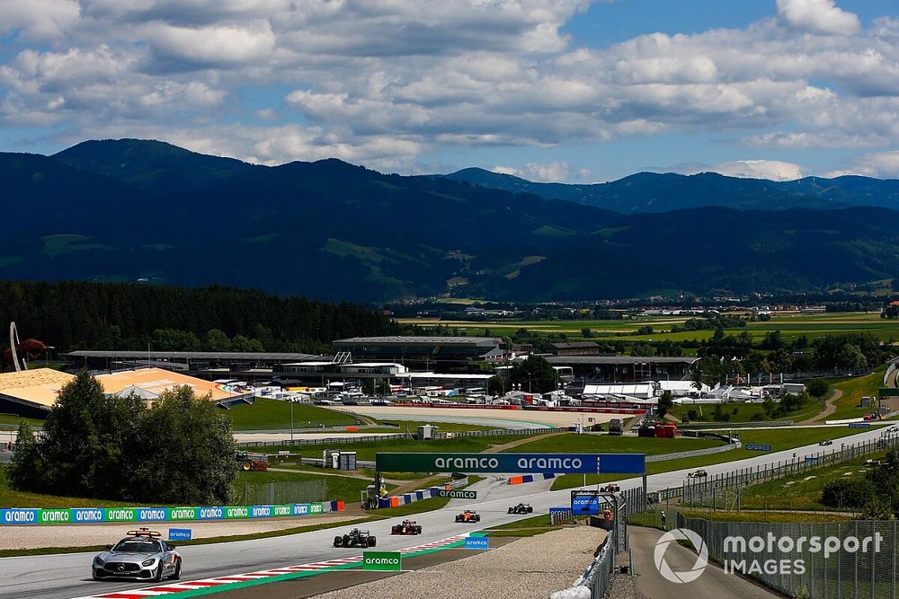 The Safety Car leads Lewis Hamilton, Mercedes F1 W11 EQ Performance, Max Verstappen, Red Bull Racing RB16, Carlos Sainz Jr., McLaren MCL35, and the rest of the field