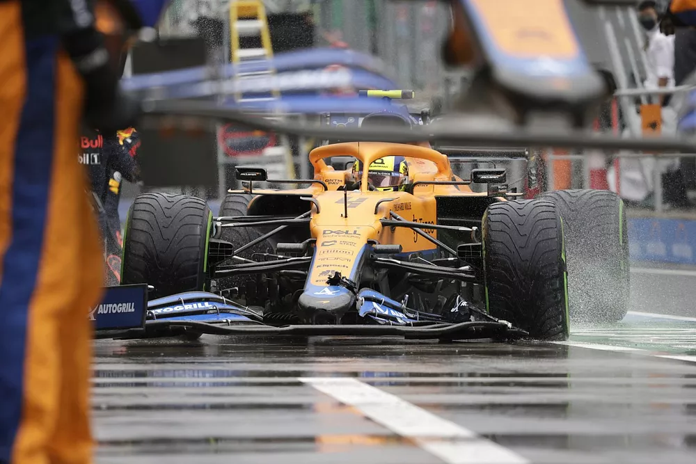 Lando Norris, McLaren MCL35M, in the pits with front wing damage