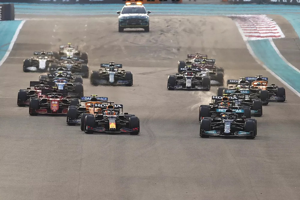 Lewis Hamilton, Mercedes W12, leads Max Verstappen, Red Bull Racing RB16B at the start