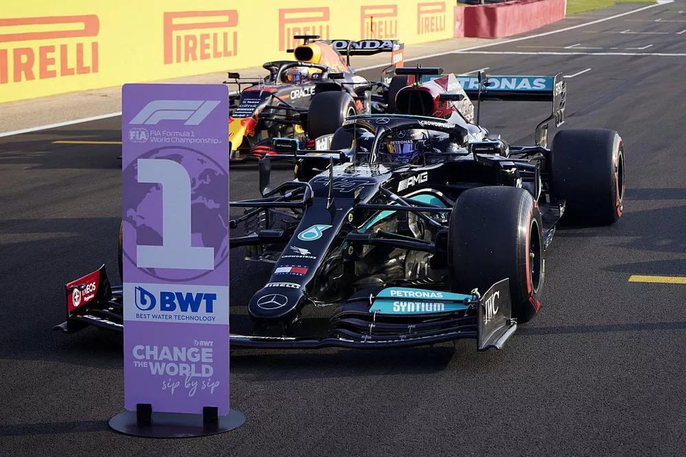 Pole man Lewis Hamilton, Mercedes W12, and Max Verstappen, Red Bull Racing RB16B, arrive in Parc Ferme after Qualifying