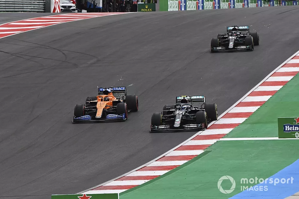 Valtteri Bottas, Mercedes F1 W11, Carlos Sainz Jr., McLaren MCL35, and Lewis Hamilton, Mercedes F1 W11