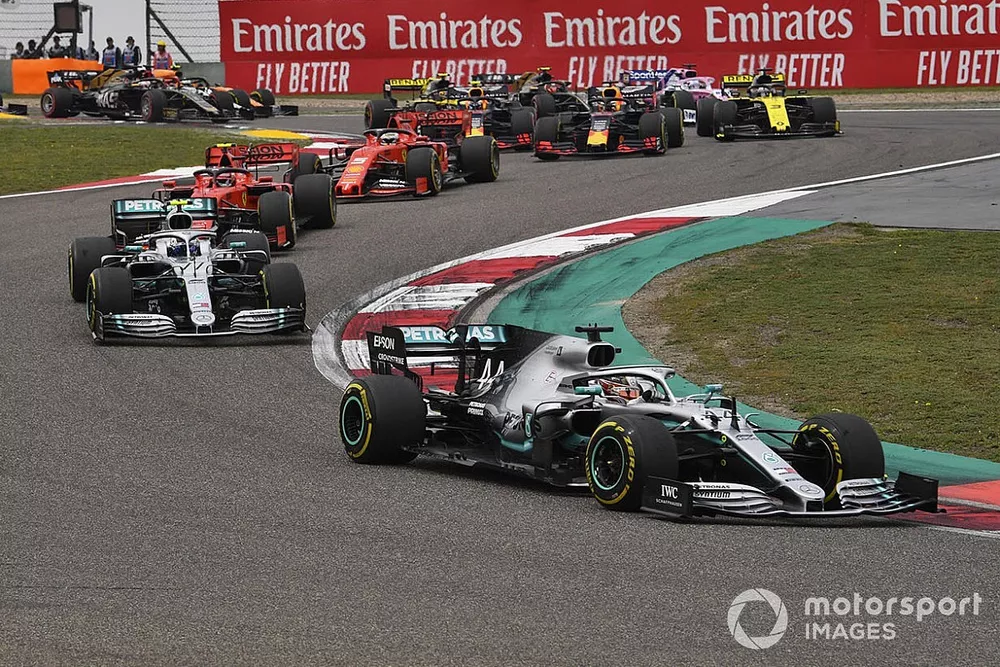 Lewis Hamilton, Mercedes AMG F1 W10, leads Valtteri Bottas, Mercedes AMG W10, Charles Leclerc, Ferrari SF90, Sebastian Vettel, Ferrari SF90, Max Verstappen, Red Bull Racing RB15, and the rest of the field at the start