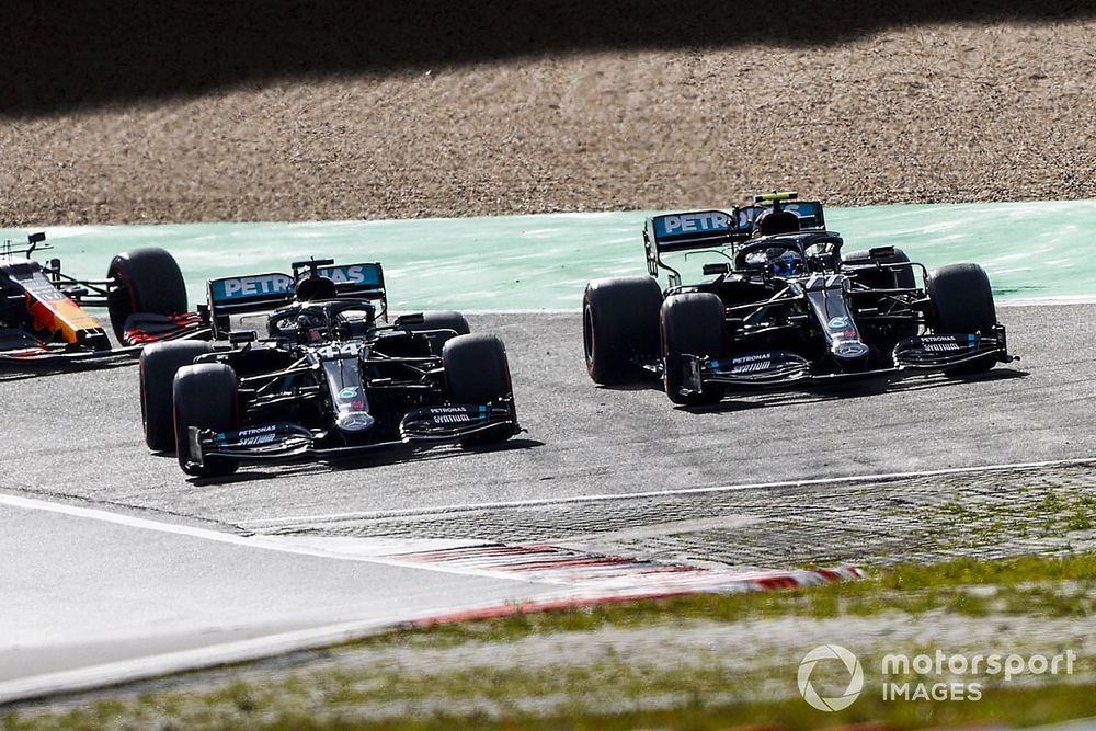 Valtteri Bottas, Mercedes F1 W11, battles with Lewis Hamilton, Mercedes F1 W11, for the lead at the start