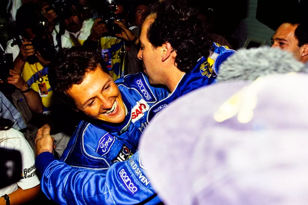 Michael Schumacher celebrates championship victory with his team