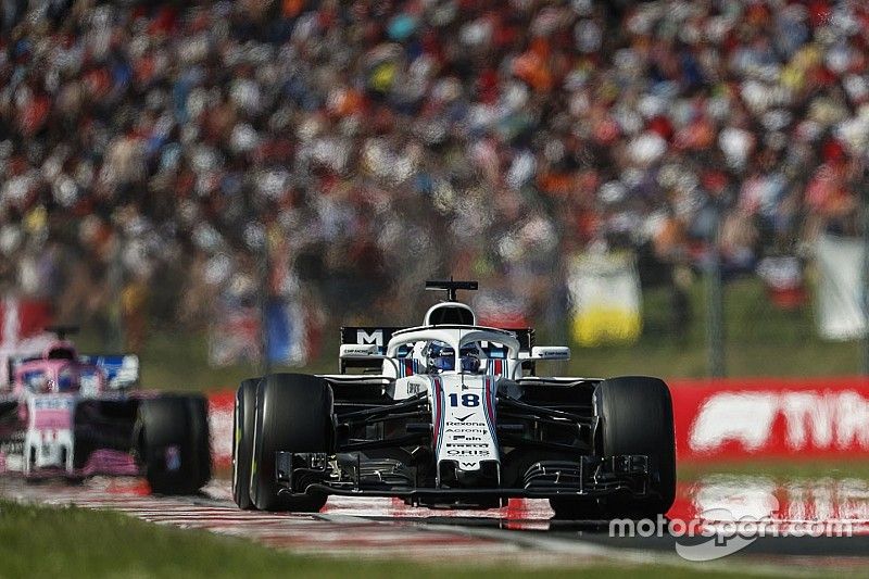 Lance Stroll, Williams FW41, leads Sergio Perez, Force India VJM11