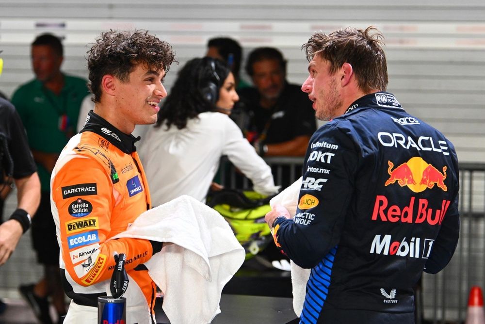 Pole Man Lando Norris, McLaren F1 Team, debriefs with Max Verstappen, Red Bull Racing 