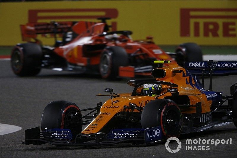 Lando Norris, McLaren MCL34, leads Sebastian Vettel, Ferrari SF90