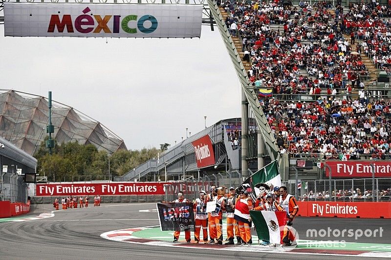 Marshals with Mexican flags ahead of the race