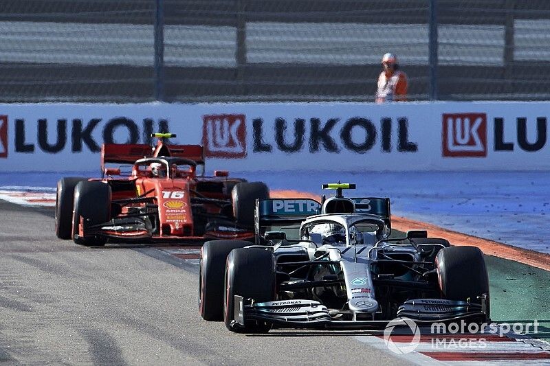 Valtteri Bottas, Mercedes AMG W10, leads Carlos Sainz Jr., McLaren MCL34