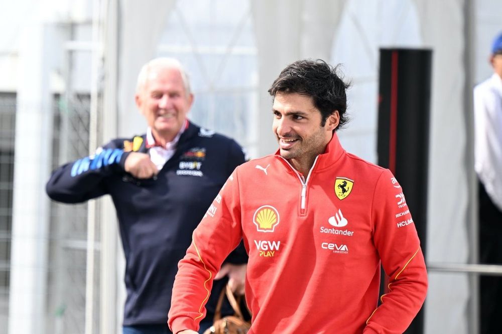 Helmut Marko, Consultant, Red Bull Racing and Carlos Sainz, Scuderia Ferrari, arriving in the paddock