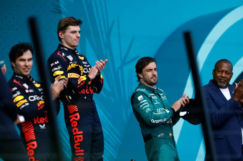 Sergio Perez, Red Bull Racing, 2nd position, Max Verstappen, Red Bull Racing, 1st position, and Fernando Alonso, Aston Martin F1 Team, 3rd position, on the podium
