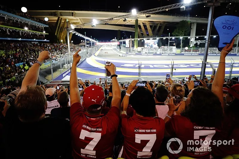 Fans enjoy the atmosphere in the grandstand at the start of the race