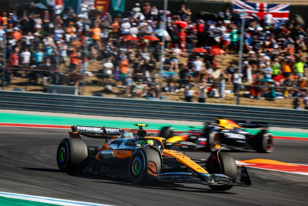 Lando Norris, McLaren MCL38, leads Max Verstappen, Red Bull Racing RB20