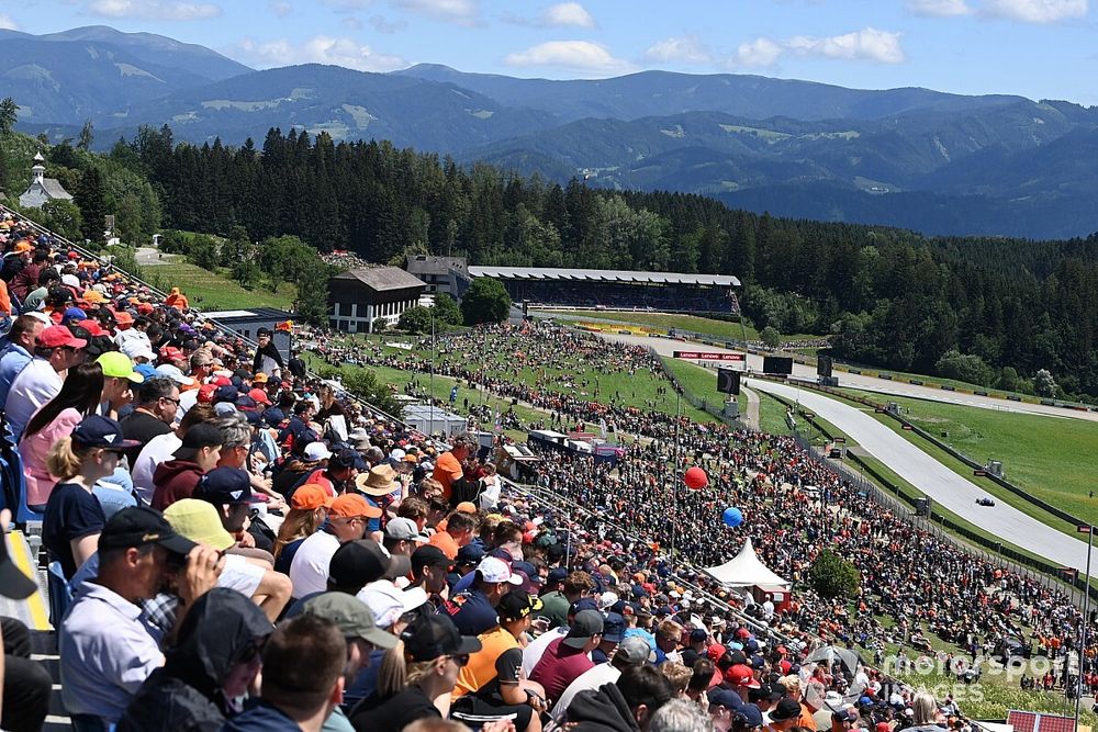 Fans watch the action from a packed grandstand