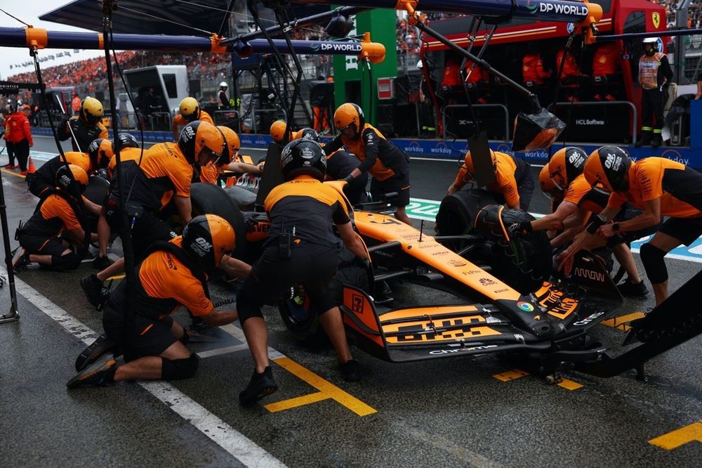The McLaren F1 Team pit crew practice a pit stop on Lando Norris, McLaren MCL38 