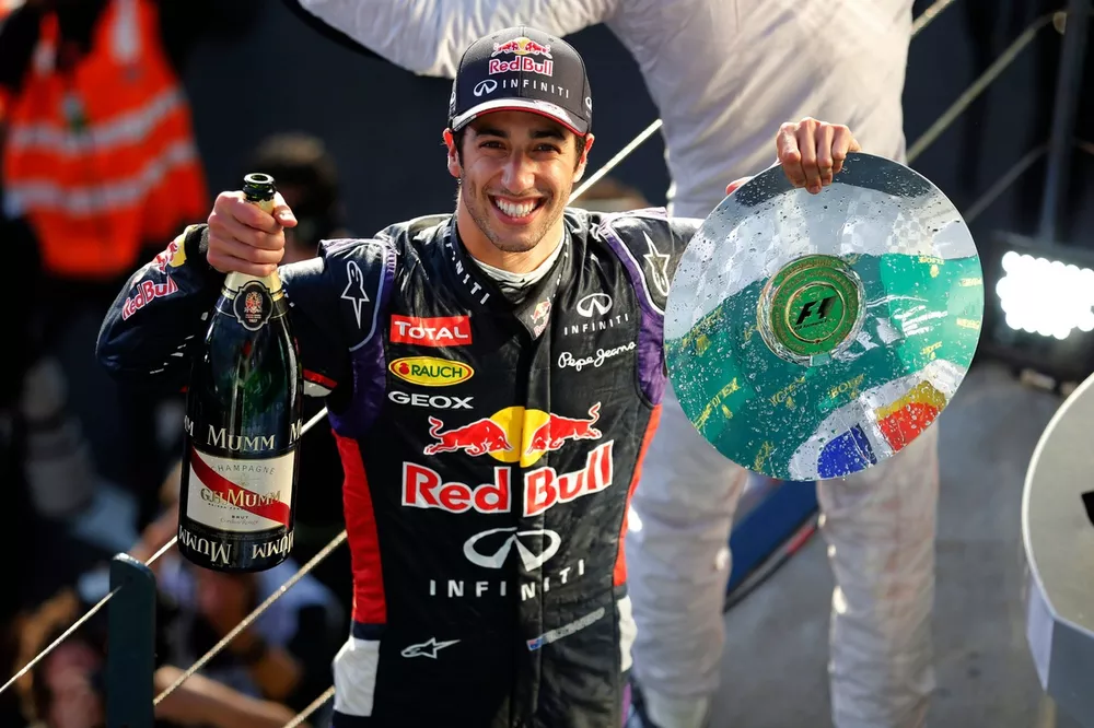 Daniel Ricciardo, Red Bull Racing, 2nd Position, on the podium with his trophy and champagne