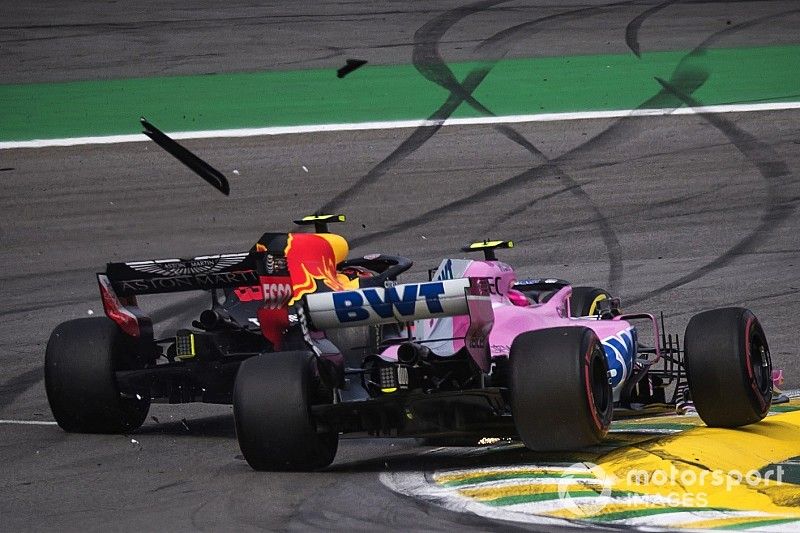 Race leader Max Verstappen, Red Bull Racing RB14 crashes whilst lapping Esteban Ocon, Racing Point Force India VJM11 