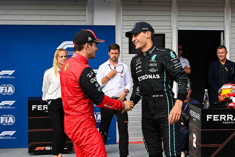 Charles Leclerc, Ferrari, congratulates pole man George Russell, Mercedes-AMG, in Parc Ferme