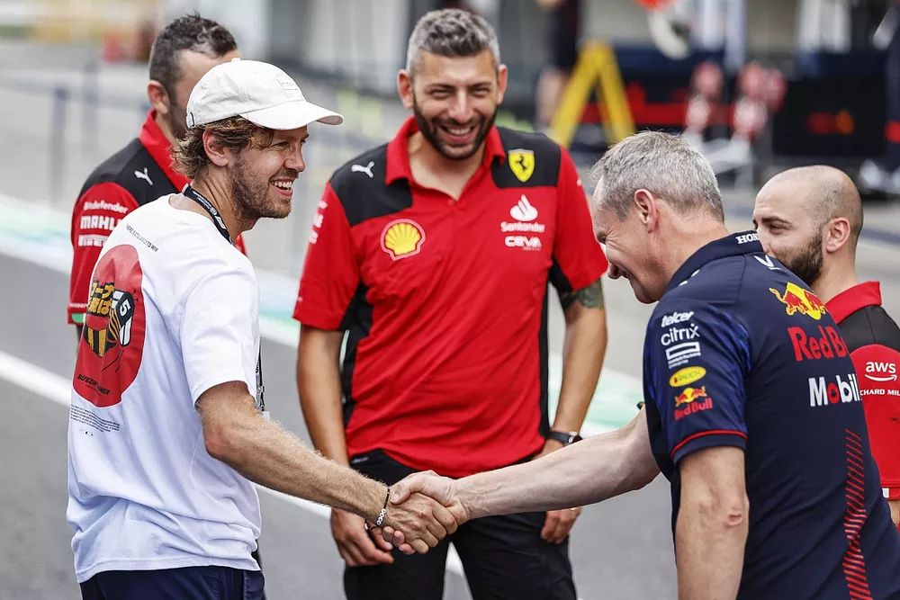 Sebastian Vettel with a Red Bull Racing team member