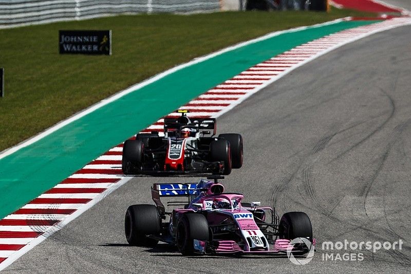 Sergio Perez, Racing Point Force India VJM11, leads Kevin Magnussen, Haas F1 Team VF-18