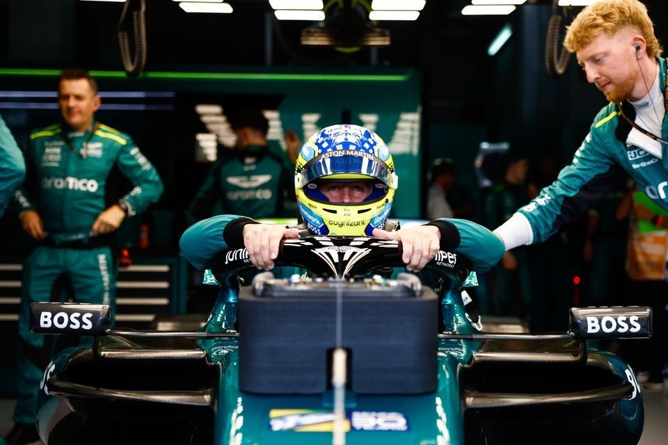 Fernando Alonso, Aston Martin F1 Team, settles into his seat