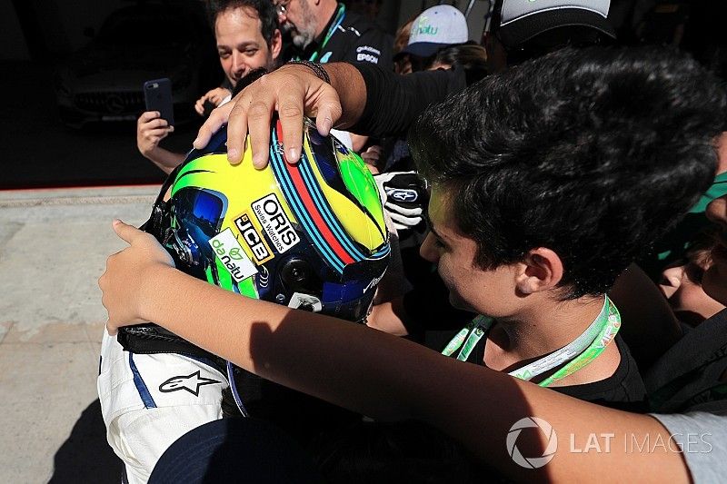 Felipe Massa, Williams FW40 celebrates his last Brazilian Grand Prix in parc ferme with his wife Ra