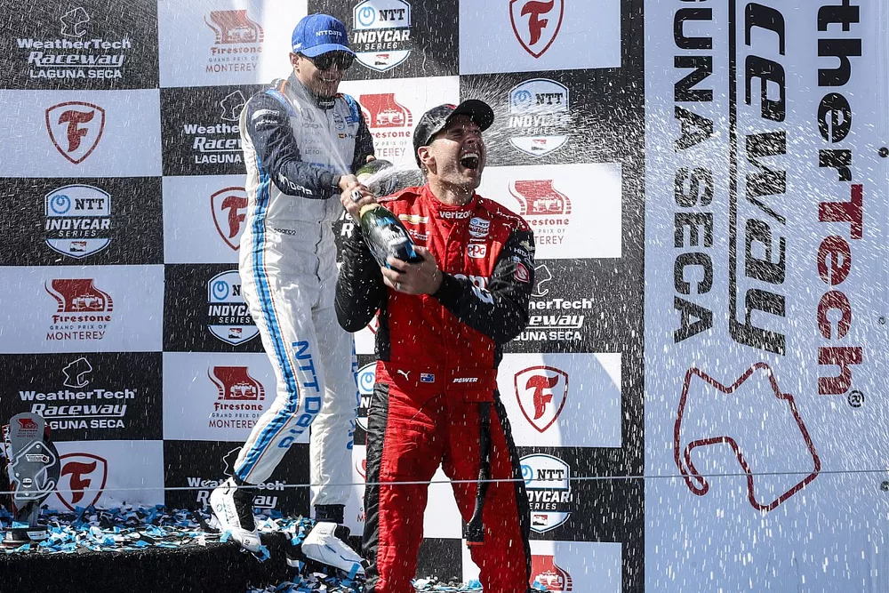 Alex Palou, Chip Ganassi Racing Honda, Josef Newgarden, Team Penske Chevrolet, Will Power, Team Penske Chevrolet celebrate on the podium with champagne