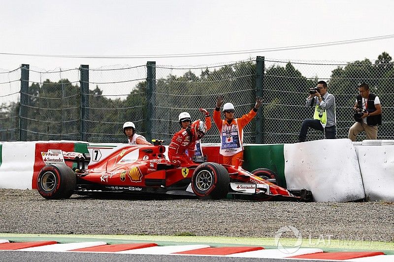 Kimi Raikkonen, Ferrari SF70H, climbs from his car after crashing