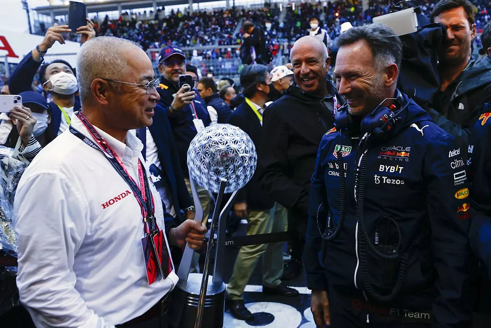 Christian Horner, Team Principal, Red Bull Racing, with the Honda Constructors trophy delegate in Parc Ferme