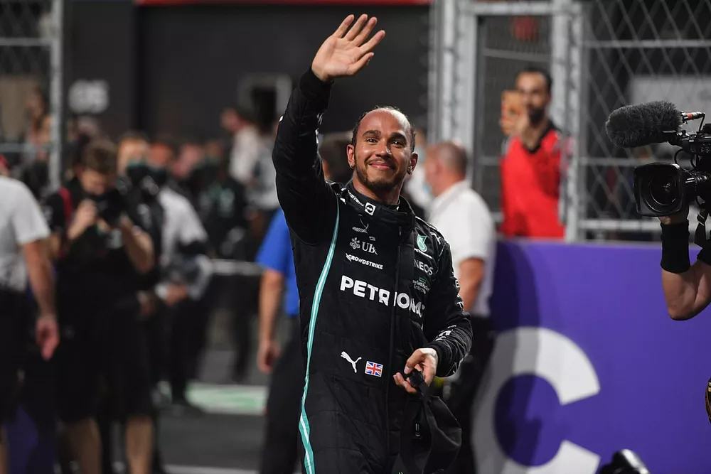 Lewis Hamilton, Mercedes, waves from Parc Ferme after securing pole