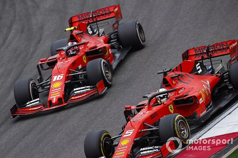 Sebastian Vettel, Ferrari SF90, leads Charles Leclerc, Ferrari SF90