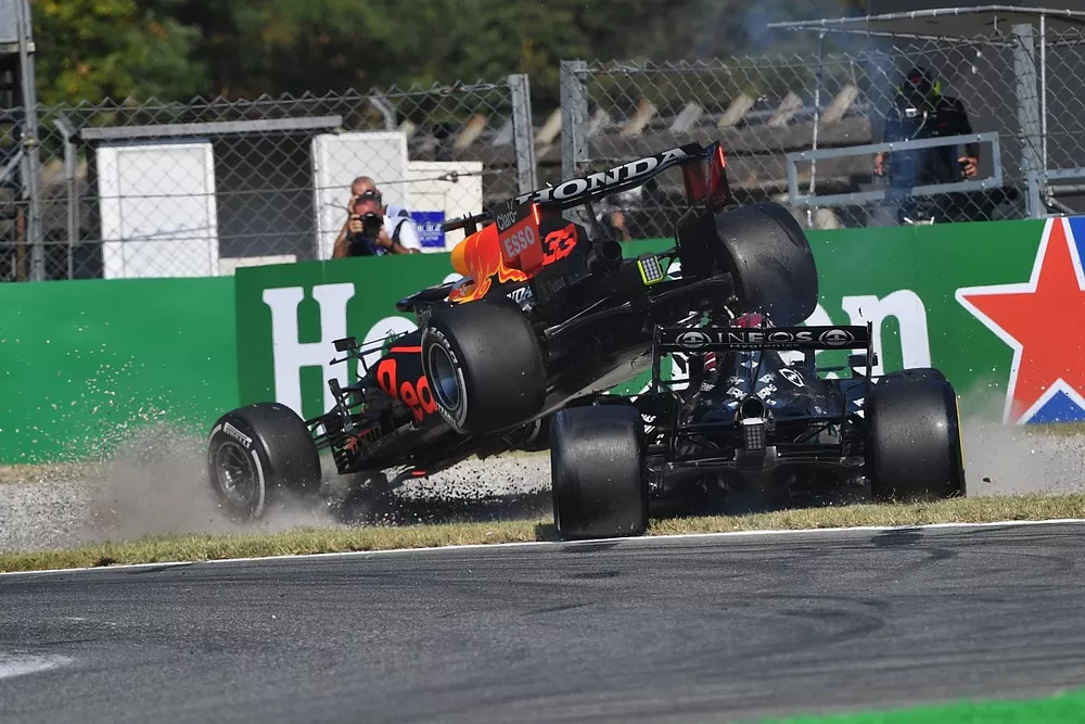 Max Verstappen, Red Bull Racing RB16B, and Lewis Hamilton, Mercedes W12, collide