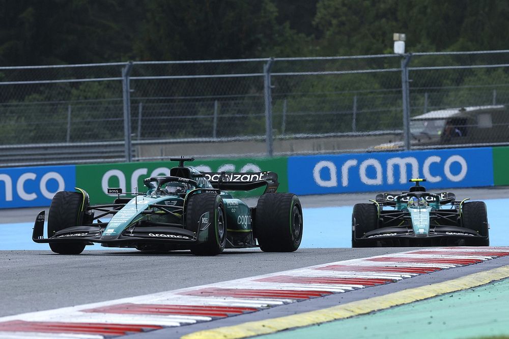 Lance Stroll, Aston Martin AMR23, leads Fernando Alonso, Aston Martin AMR23