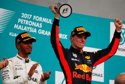 Winner Max Verstappen, Red Bull Racing, raises his trophy on the podium