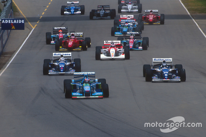 Michael Schumacher, Benetton B194 Ford leads Damon Hill and Nigel Mansell, Williams FW16B Renault