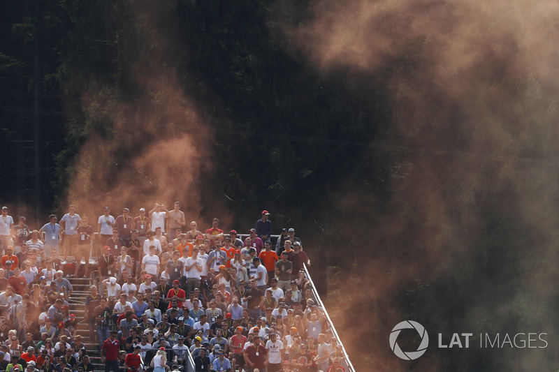 Dutch fans set off oramge flares from a stand