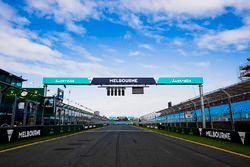 Melbourne signage along the pit straight and above the start light gantry