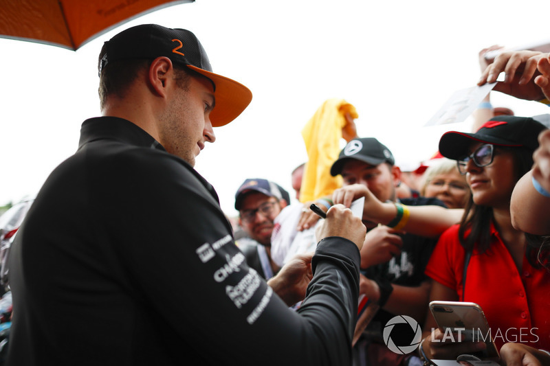Stoffel Vandoorne, McLaren, signs autographs for fans