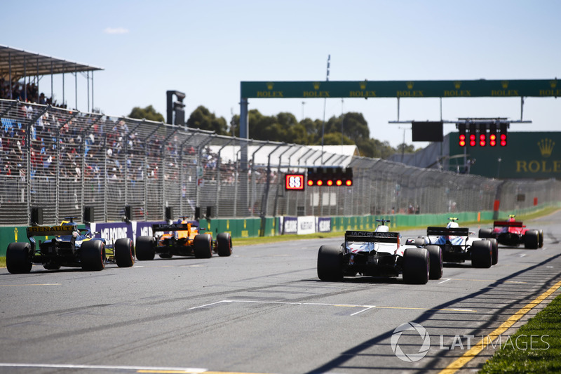 Kimi Raikkonen, Ferrari SF71H, Sergey Sirotkin, Williams FW41 Mercedes, Fernando Alonso, McLaren MCL33 Renault, Romain Grosjean, Haas F1 Team VF-18 Ferrari, and Nico Hulkenberg, Renault Sport F1 Team R.S. 18. line up on the grid for practice starts