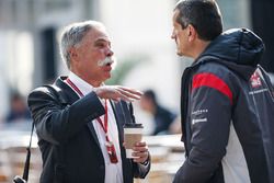 Chase Carey, Chief Executive Officer and Executive Chairman of the Formula One Group and Guenther Steiner, Haas F1 Team Principal