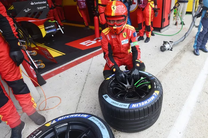 Ferrari AF Corse mechanic with rain tires