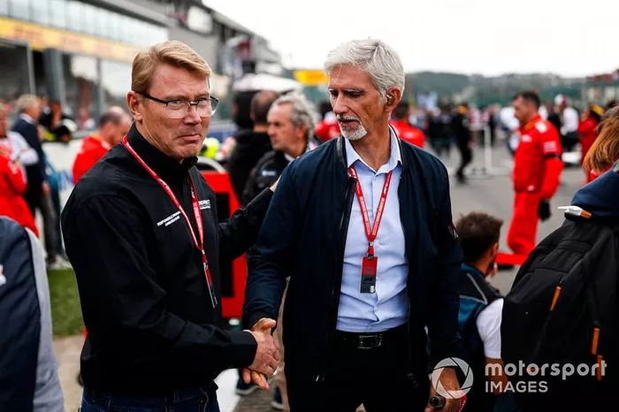 Former world champions Mika Hakkinen and Damon Hill on the grid