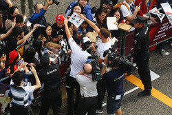 Fernando Alonso, McLaren and Jenson Button, McLaren sign autographs for the fans