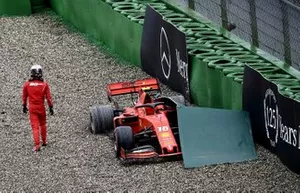 Charles Leclerc, Ferrari, walks away from his car after crashing out of the race