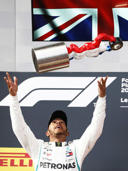 Lewis Hamilton, Mercedes AMG F1, celebrates on the podium after winning the race