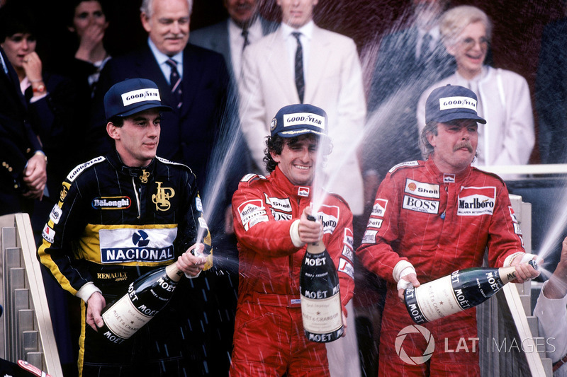 Podium: race winner Alain Prost, McLaren, second place Keke Rosberg, McLaren, third place Ayrton Senna, Lotus