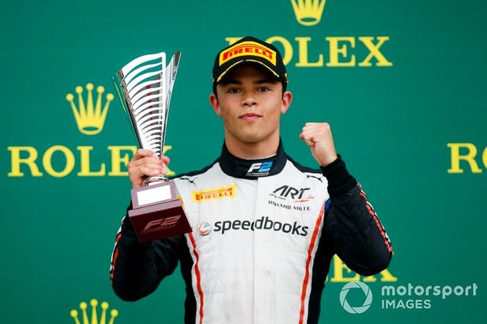Nyck De Vries, ART Grand Prix celebrates n the podium with the trophy